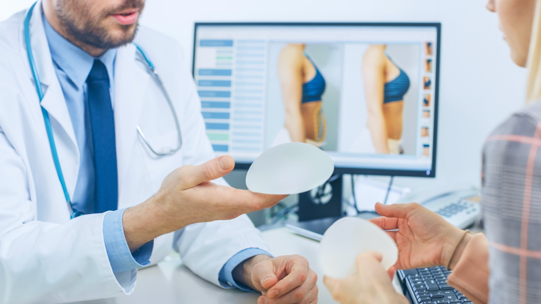 Surgery Scalpel In The News Plastic Surgeon Reviewing Breast Augumentation Options
